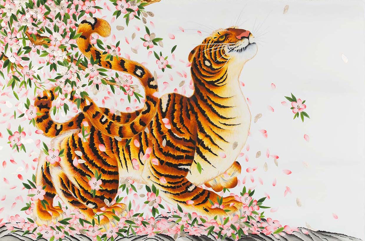 Tiger on background of Japanese cherry blossoms.